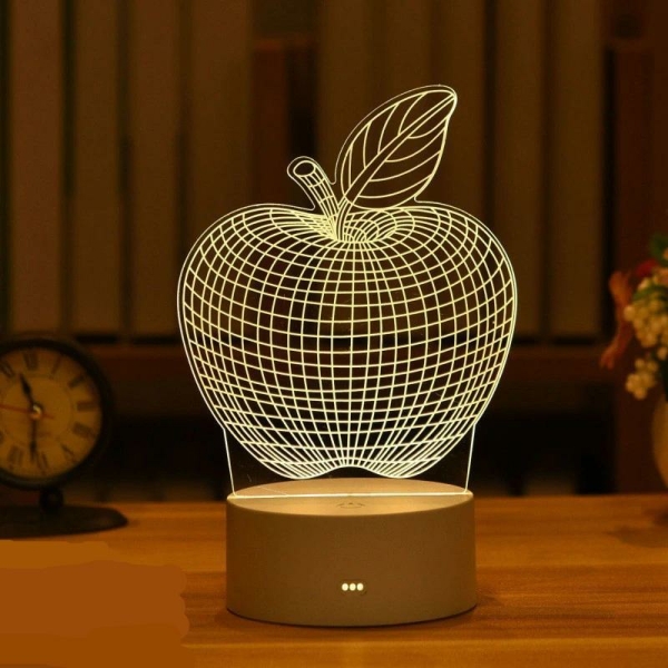 Veilleuse d'ambiance à motif pomme en style 3D pour fille. Bonne qualité et très à la mode sur une table dans une maison