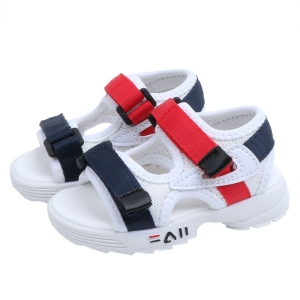 Sandale à semelle souple de couleur blanche et aux scratchs rouges et noirs