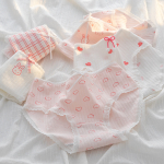 Culottes pour fille dans les tons blanc et rose avec petits nœuds, motifs cœurs, lapins et rayures, en coton côtelé