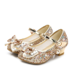 Chaussures de princesse à paillettes avec nœud papillon pour filles doré avec un fond blanc