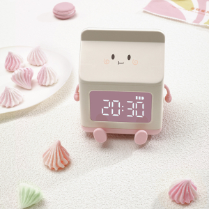 Radio réveil en forme de boîte à lait créative pour filles avec un fond blanc et des bonbons sur le côté