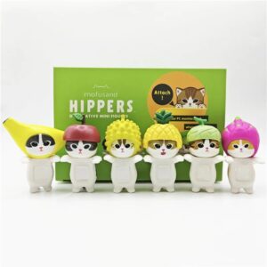 Boîte de blind box Mofusand Hippers avec figurines de chats déguisés en fruits tropicaux, présentée en packaging vert décoratif.