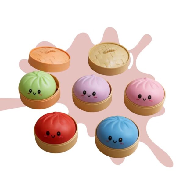 5 boites avec à l'intérieur un squishy dumpling en fortme de brioche vapeur, toutes d'une couleur différente.